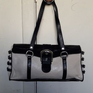 Black & Ivory leather purse with decorative side buckles